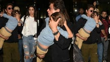 IN PICS: Doting DAD Shah Rukh Khan carries a SLEEPY AbRam at the Airport as he returns back from Duabi with co-star Anushka Sharma!