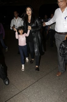 IN PICS: Aishwarya spotted with daughter Aaradhya at Airport; Hugs hubby Abhishek before leaving!
