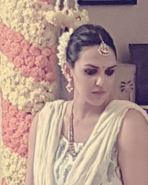 And now hold your breadth as here's the first pic from Esha's traditional godh bharai function where she is all decked up as a new bride! Esha posted this pic on her Instagram account with a caption: Getting ready for the Godh bharai ceremony ! Hair done make up done ✅???? #GodhBharai