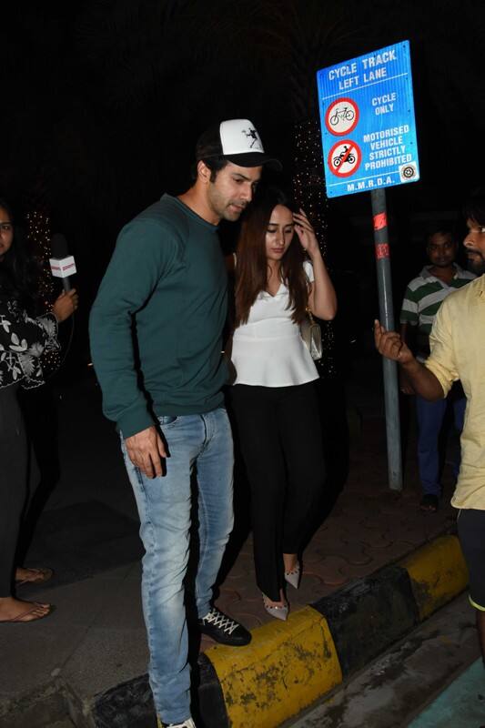 Varun Dhwan was a protective boyfriend as he made sure to lead his ladylove safely to the car 