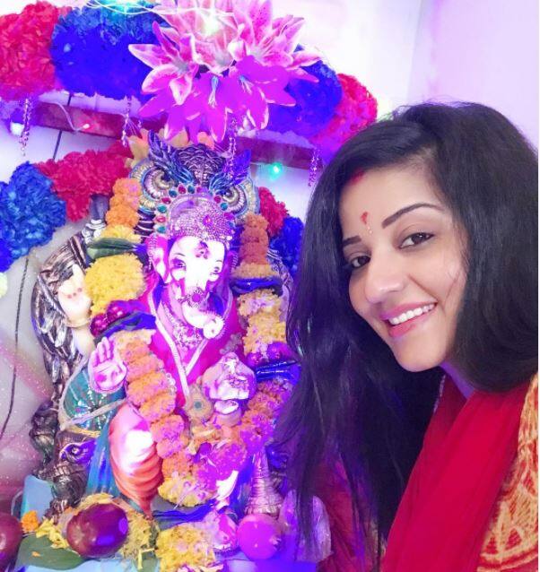 Bigg Boss fame Monalisa posing alongside her bappa