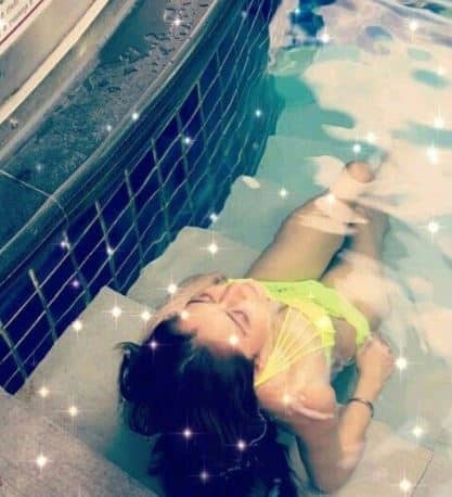 Donning a florescent coloured bikini Ssara is looking every inch of a sexy babe while chilling in a pool 