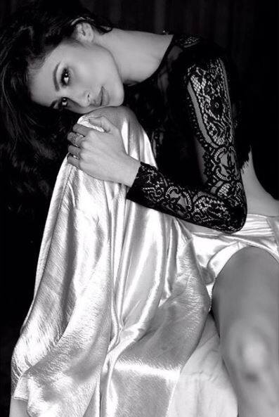Here's a pic in which Mouni is looking stunning in a sheer black top and a silk tie-up skirt. (Photo: Instagram)