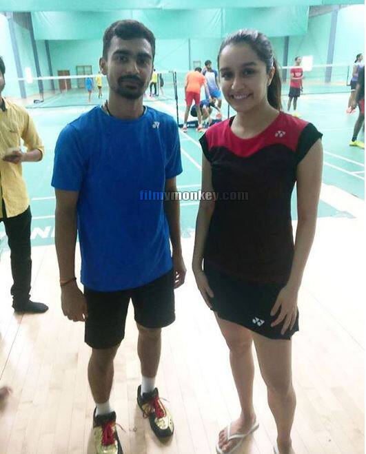 Fan gets a picture clicked with the pretty Shraddha and you can't miss her slippers. Looks like the actress took a break from training and a player approached her for click. (Pic: Shraddha FC Instagram)