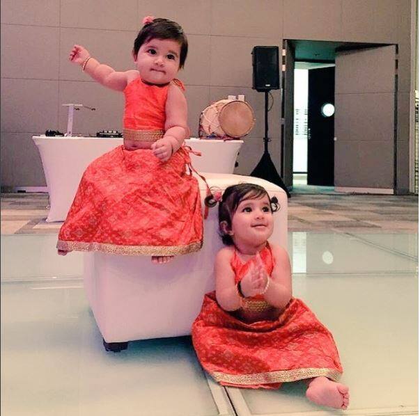 For the sangeet the cuties opted for a bright orange coloured lehenga and we just can't take our eyes off their sheer cuteness 