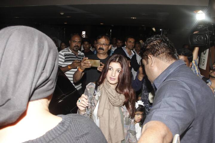 The beautiful Twinkle Khanna protecting daughter Nitara as the duo make an exit