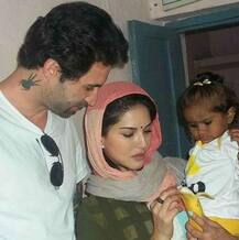 Sunny Leone & hubby Daniel get clicked with their little princess Nisha at Airport!
