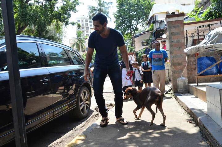 John shows his pet dog 'Bailey' to a veterinarian in Bandra