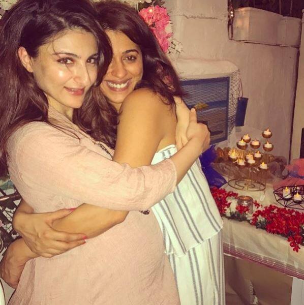 Here's another pic posted by Soha in which she is flaunting her huge baby-bump as she is hugging a friend in it. The pic has been captioned as, 