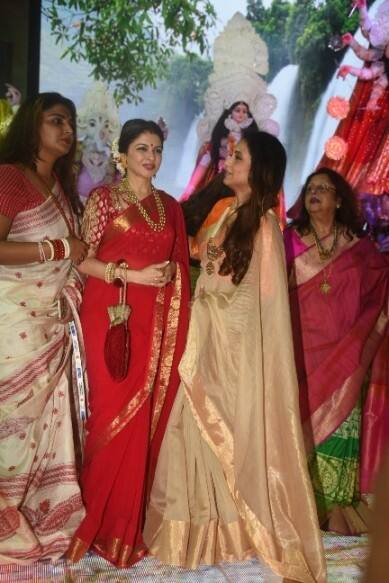 Bhagyashree looked ravishing in a red saree while Rani was glowing in a golden and orange saree.