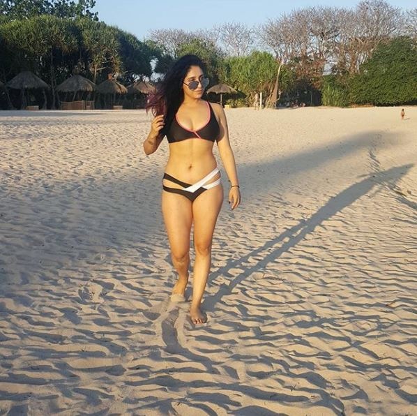 Neha posted this stunning bikini picture on Instagram in which she is taking a stroll on the beach in a bikini. She captioned it as, 