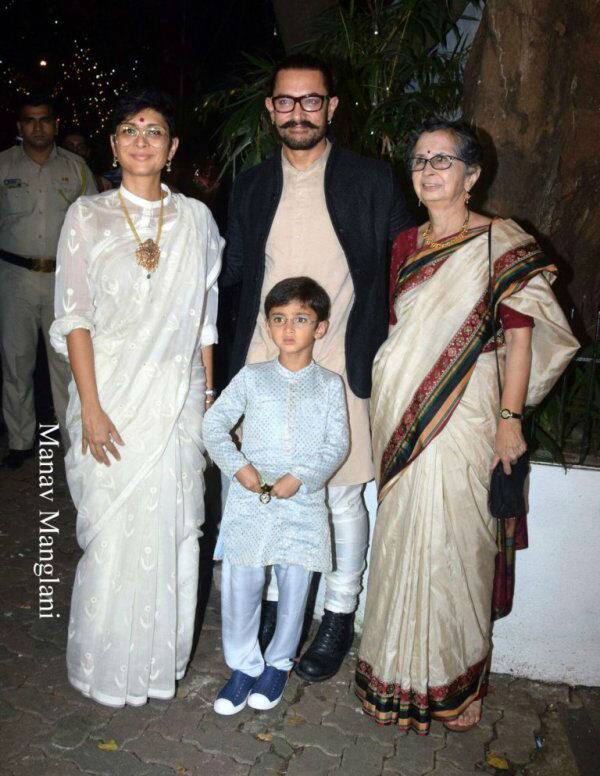 Here's the dashing host posing with his family, wife Kiran and son Azad