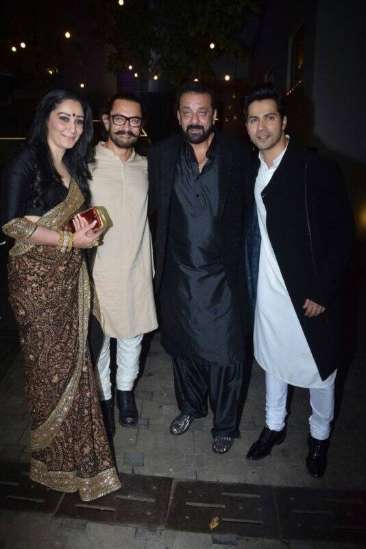 Sanjay Dutt and wife posing with Aamir Khan and Varun Dhwan