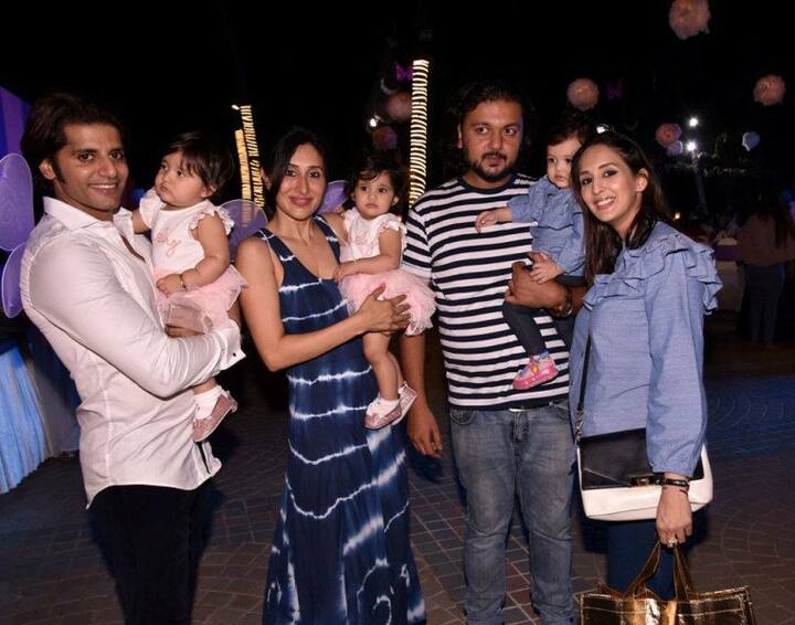TV actress Chahatt Khanna with hubby and daughter Zohar posing with the hosts and the birthday girls