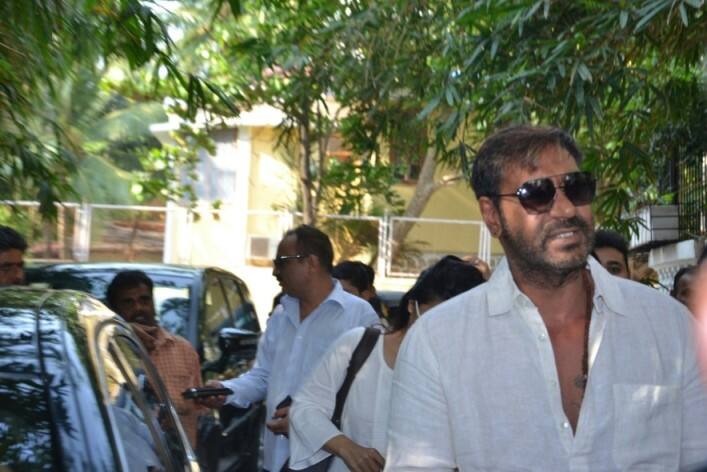 Clad in white, Ajay with his family arrived at the special screening of the film at Juhu.