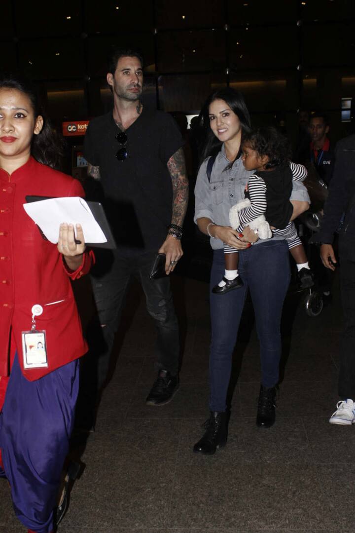 The parents were recently spotted at the airport with Nisha as they return from Dubai. Check out the pictures here...(Photo: Manav Manglani)