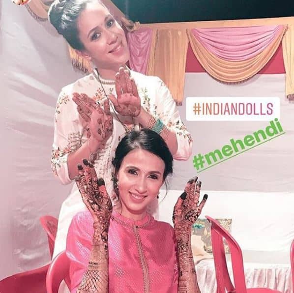 The couple was very excited for their marriage and Alesia posted this pic from her mehendi ceremony with sister Anjali and captioned it as,