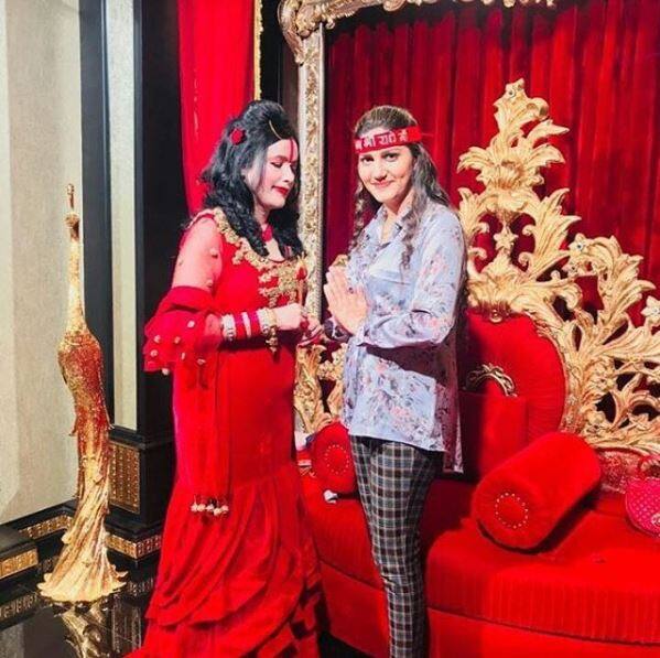 She recently shared a pic where she is taking blessings with self-styled god woman Raadhe Maa! 