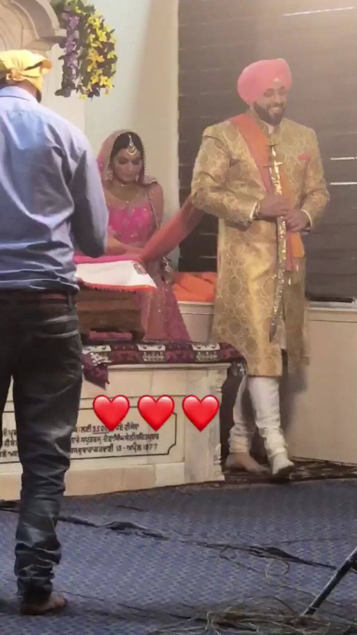 Here's the couple taking pheras!