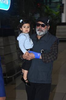 IN PICS: Shahid Kapoor's BABY GIRL Misha looks like a doll in her dadaji Pankaj Kapur's arms as they exit the airport with Mira Rajput!