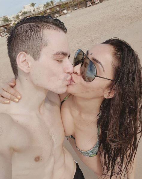 Sofia has shared few pics in which she is having fun with hubby at a beach looking super-hot in a tow-iece bikini. She posted this romantic pic of locking-lips with hubby Vlad with the caption, 