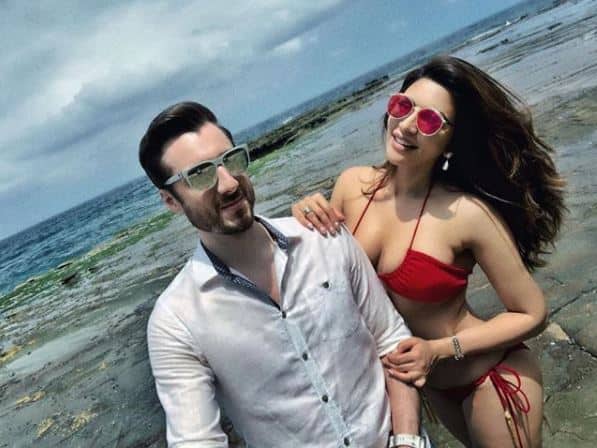 Few days ago, Shama's fiance James Milliron shared a picture with the actress posing in a bikini. Now, Sharma has another throwback picture in which she's performing yoga in the same red hot bikini. (Photo: Instagram)