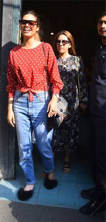 Esha Gupta makes a spotting with her sister-designer Neha Gupta at Pali village cafe in bandra