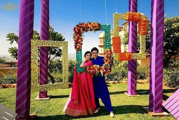 The couple seems to have had a lot of fun during their wedding festivities. Here's a picture of Gautam & Pankhuri posing at thei mehendi ceremony. (Photo: Instagram/ @knottingbells)