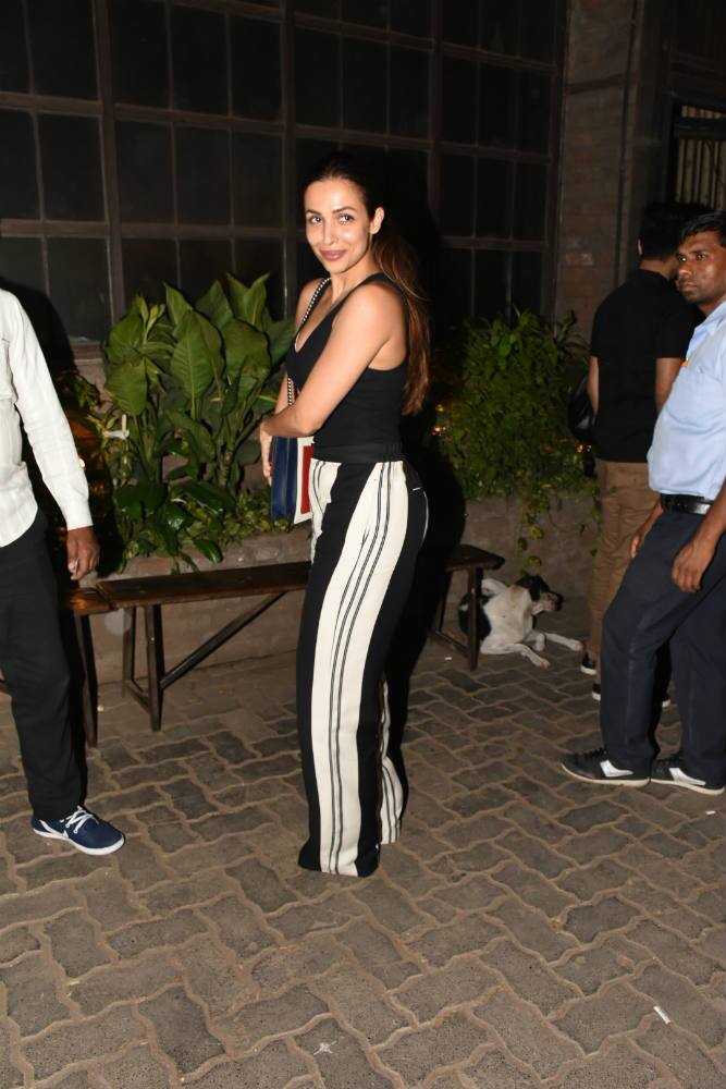 Malaika opted for a black tee and paired it with striped pants.(Photo: Manav Manglani)