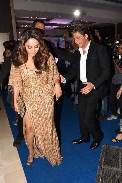 Gauri Khan donned a Monisha Jaising's gold sequin outfit and SRK completely stole hearts by escorting wife who was carring a thigh-high slit gown while making their entry at the awards.