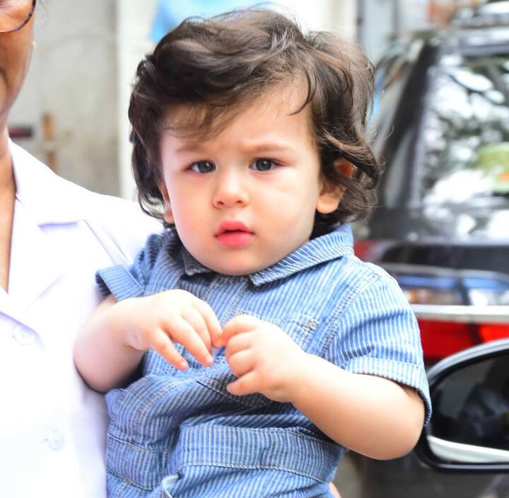 Wrapped in his nanny's arms the cutie pie was gazing into paps lenses. (Photo: Manav Manglani)