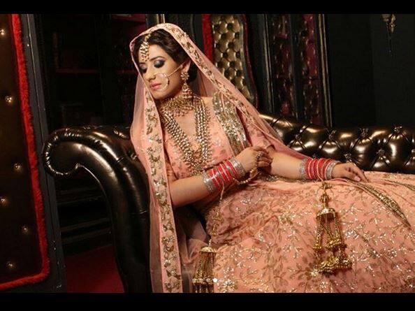 Look was completed with golden kundan jewellery and red ‘choora’. Image Courtesy – Instagram 