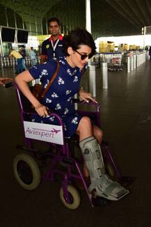 Injured 'Bigg Boss' hottie Mandana Karimi snapped on a wheelchair & then with a walker at Airport!