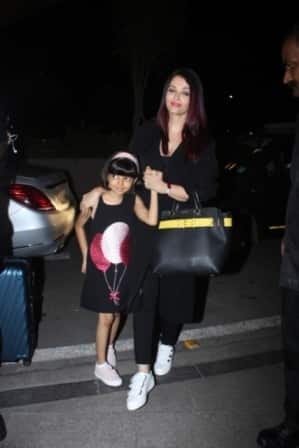 Aishwarya wore casual yet classy black jeans-top with long overcoat.
