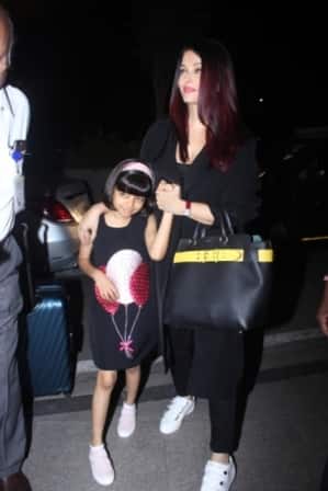Aaradhya looked cute in a black dress with pink headband and white-pink shoes!