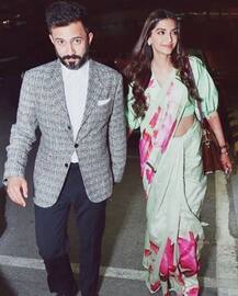 IN PICS: Newlywed Sonam Kapoor leaves for Cannes with hubby Anand Ahuja! Check out their in-flight ROMANCE!