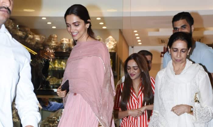 Deepika and mother Ujjala making way out of a Bandra store post shopping here!