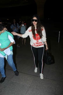IN PICS: Kareena Kapoor Khan and her sleeping BABY Taimur clicked at the airport as they leave for London for family vacation!