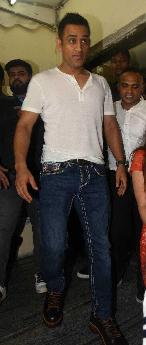 Cricketer Mahendra Singh Dhoni too attended 'Race 3' screening with his beautiful wife Sakshi. (Photo: Manav Manglani)