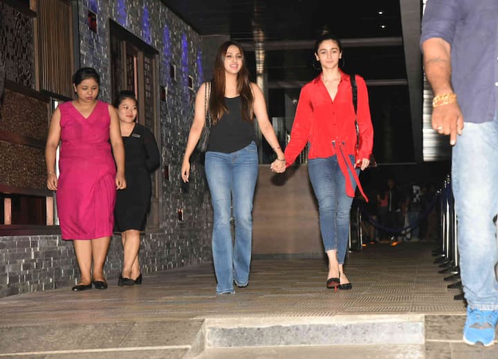 Alia looked stunning in a red top and blue denim. 