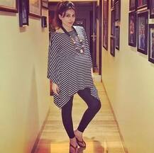 Mommy-to-be Soha Ali Khan flaunts her growing BABY BUMP in the cutest pic with her pet!