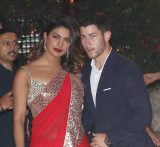 Whereas Nick Jonas looks handsome in a black suit. (Photo: Manav Manglani)