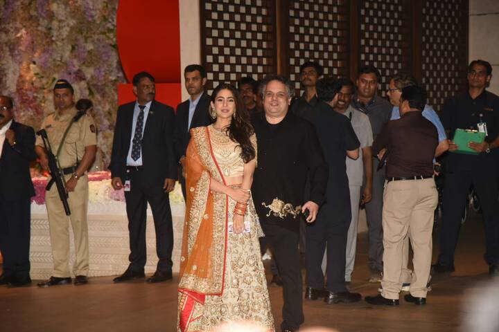 Sara looked elegant wearing a heavy orange lehenga.