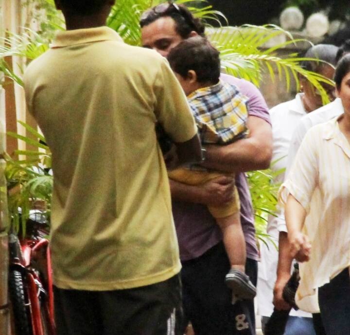 Cutie Taimur in Dad Saif's arms as they make a spotting in Bandra today