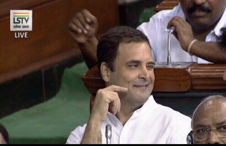 Rahul then returns to his seat and give a wink to party colleagues that was caught on camera too. Obviously the The pictures and video from this moment spread like wild fire on internet and the whole nation is talking about it, even calling it 