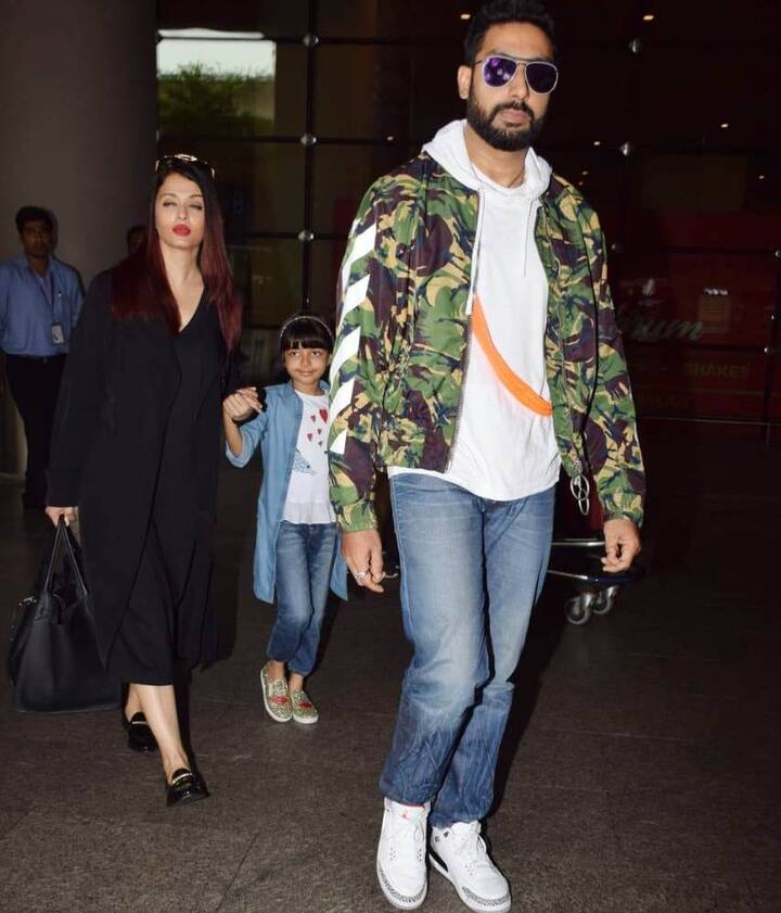 As the trio headed towards their car, Aaradhya looked amused with the paps trying to capture each moment of this star-family and she also behaved like a 'star'.