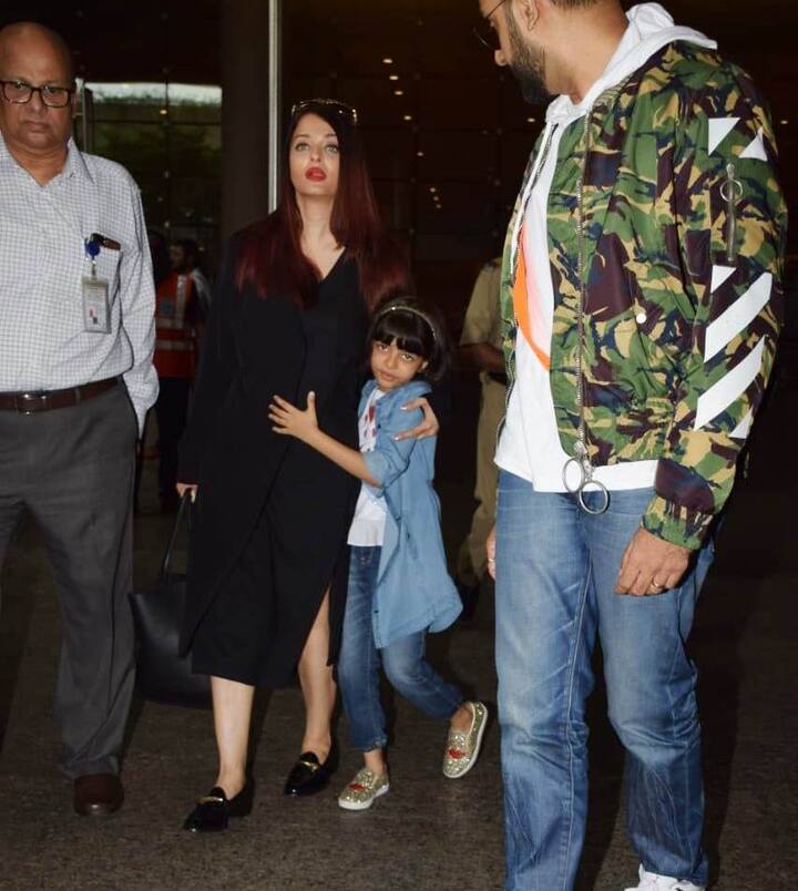 Awww! Aaradhya hugs Mommy, probably getting irked by the constant attention that earlier made her happy! Kids you see!