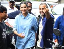 Anand Ahuja picks wife Sonam Kapoor up in his arms posing at his store Veg Non Veg launch! Pics!