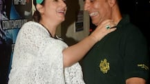 Wife Twinkle Khanna grabs Akshay Kumar by the neck posing for the paps as the couple was on a movie date!