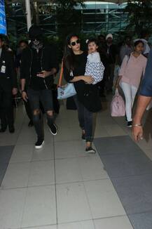 Shahid Kapoor SPOTTED with wife Mira & daughter Misha at Airport; HIDES new look with SCARF!